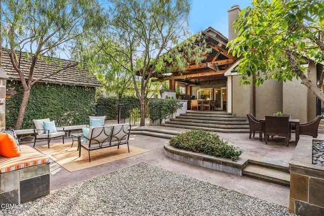 view of patio / terrace with outdoor dining area and an outdoor living space