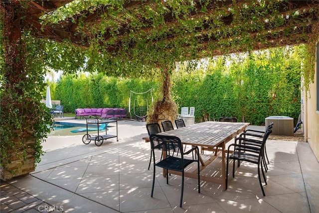 view of patio / terrace with cooling unit, outdoor dining area, and an outdoor living space