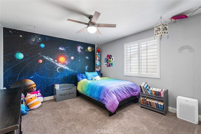 bedroom featuring carpet floors, baseboards, and a ceiling fan