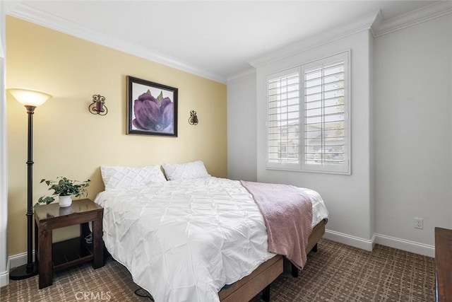 carpeted bedroom featuring baseboards and crown molding