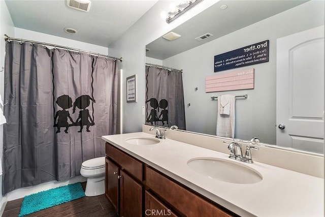 34908 Kooden Rd, Winchester, CA 92596 - full bath with wood finished floors, toilet, double vanity, and a shower with curtain