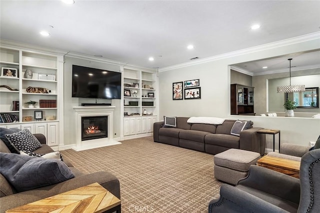 living room featuring carpet floors, recessed lighting, ornamental molding, and a glass covered fireplace