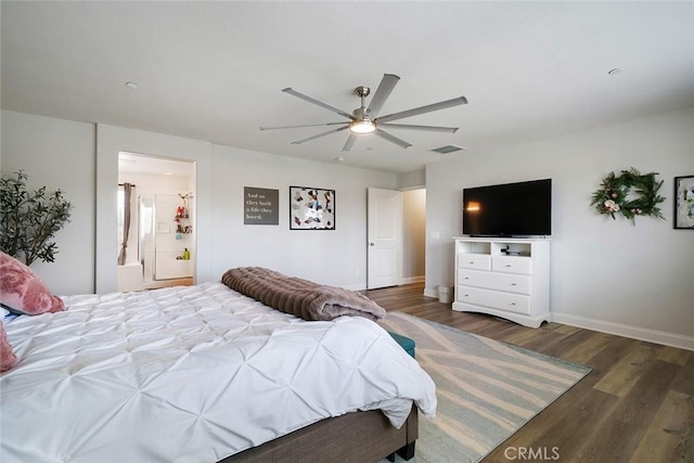 bedroom featuring visible vents, ensuite bathroom, a ceiling fan, wood finished floors, and baseboards