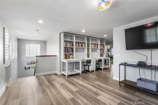 office with recessed lighting, baseboards, and wood finished floors