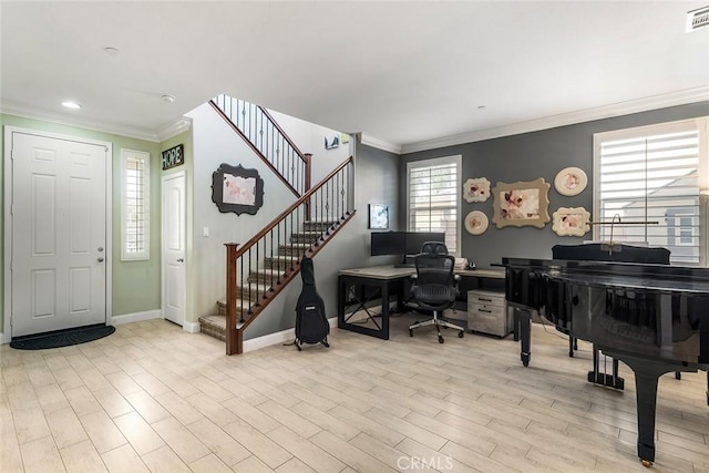 entryway with ornamental molding, stairway, wood finished floors, and visible vents