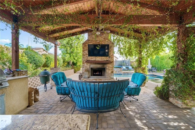 34908 Kooden Rd, Winchester, CA 92596 - view of patio / terrace featuring an outdoor kitchen and an outdoor living space with a fireplace