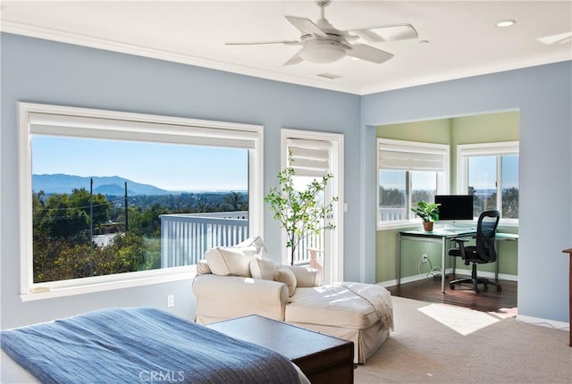 carpeted bedroom with access to exterior, crown molding, a mountain view, ceiling fan, and baseboards