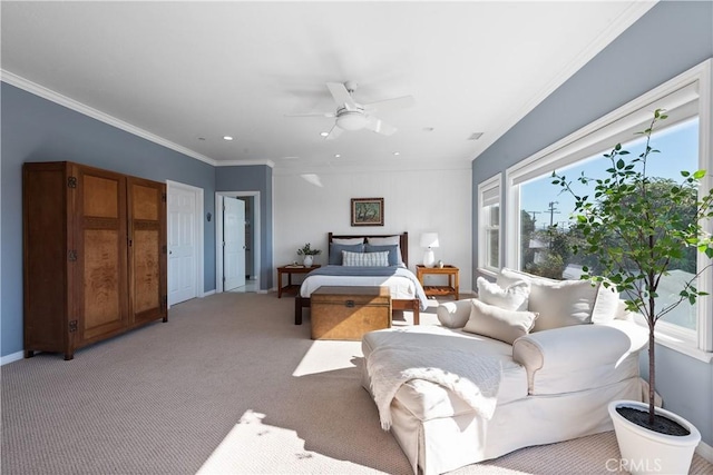 bedroom with light carpet, baseboards, ornamental molding, and ceiling fan