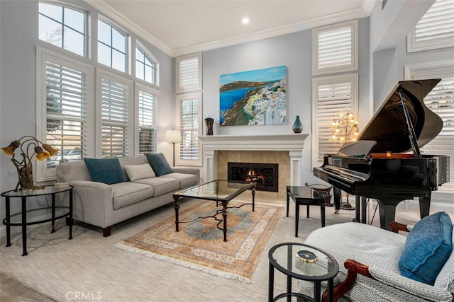 sitting room featuring recessed lighting, crown molding, and a premium fireplace