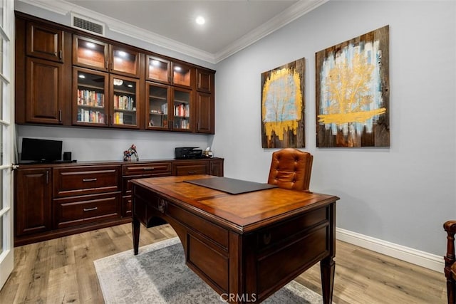 home office with recessed lighting, visible vents, light wood-style flooring, ornamental molding, and baseboards