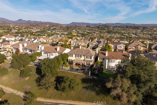 drone / aerial view with a residential view and a mountain view