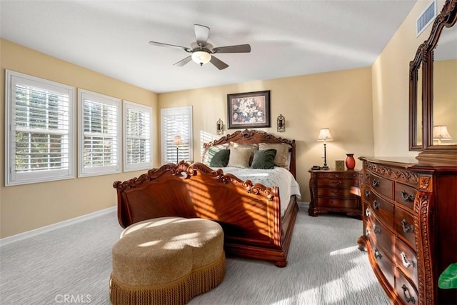 bedroom featuring ceiling fan, carpet, visible vents, and baseboards