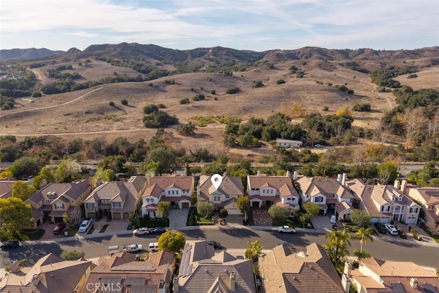 drone / aerial view featuring a residential view and a mountain view