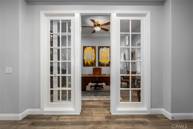 doorway to outside featuring french doors, baseboards, and wood finished floors