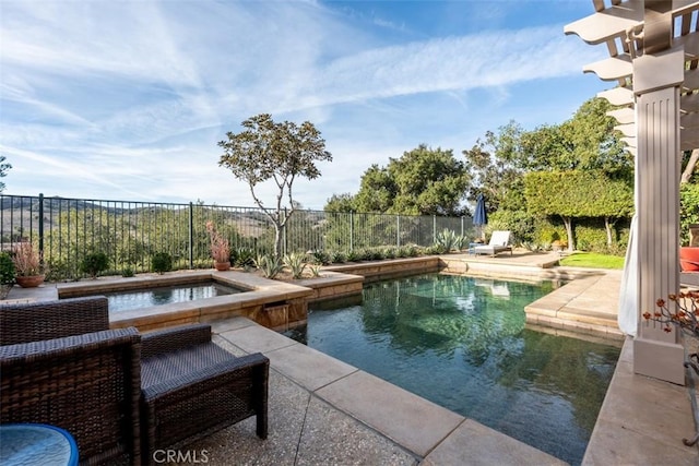 view of pool featuring an in ground hot tub, a patio area, fence, and a fenced in pool