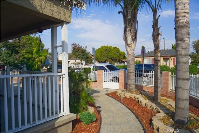 view of yard with fence and a gate