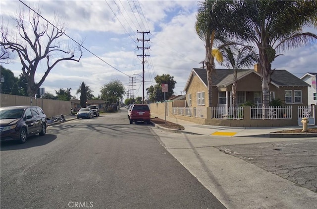 view of road featuring a residential view, curbs, and sidewalks