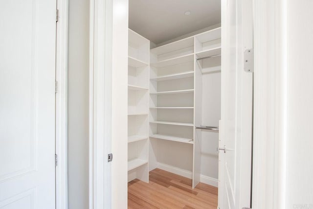 spacious closet with light wood-style flooring