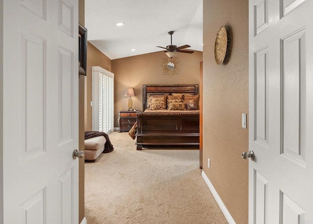 carpeted bedroom with vaulted ceiling, recessed lighting, baseboards, and ceiling fan