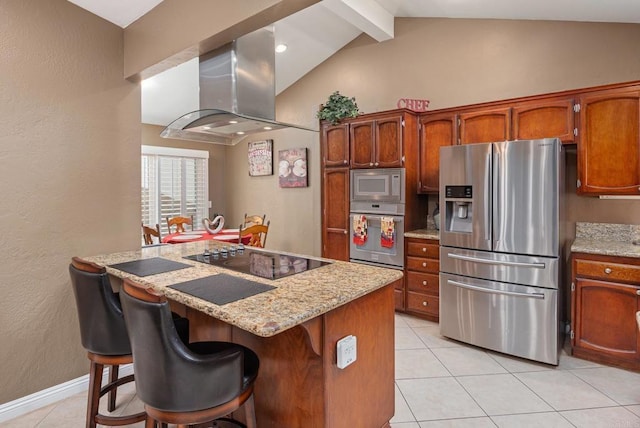 kitchen featuring range hood, a breakfast bar area, light tile patterned floors, lofted ceiling with beams, and appliances with stainless steel finishes