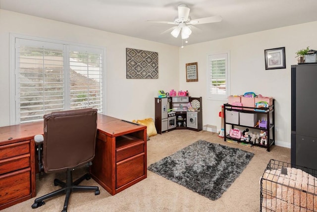 office with baseboards, carpet, and a ceiling fan