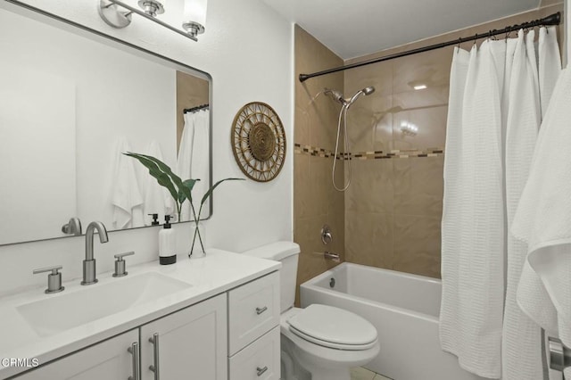 full bathroom featuring vanity, shower / bath combo with shower curtain, and toilet