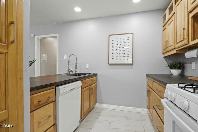 kitchen featuring recessed lighting, white appliances, a sink, dark countertops, and glass insert cabinets