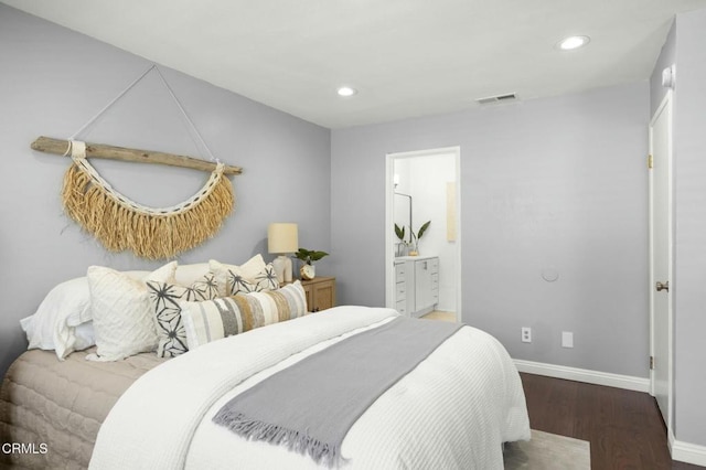 bedroom with recessed lighting, wood finished floors, visible vents, baseboards, and ensuite bath