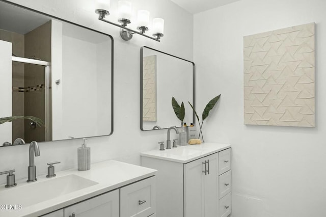 full bathroom with two vanities and a sink