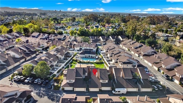 birds eye view of property with a residential view