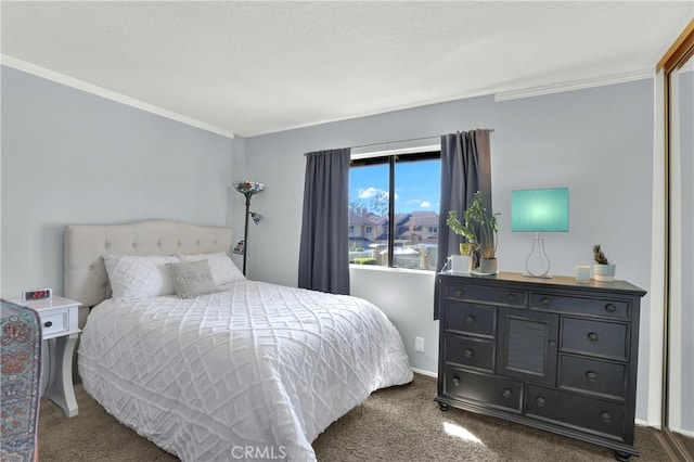 bedroom featuring carpet floors, baseboards, and ornamental molding