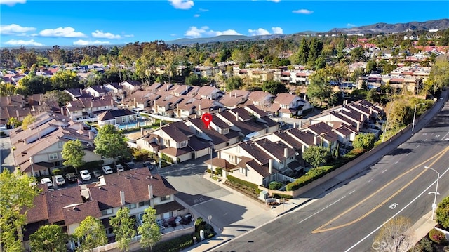 drone / aerial view featuring a mountain view and a residential view