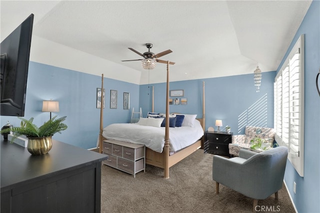 bedroom featuring ceiling fan, carpet floors, and vaulted ceiling