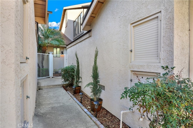 view of side of property with stucco siding