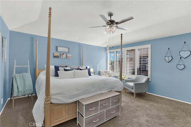 bedroom featuring lofted ceiling, baseboards, dark carpet, and ceiling fan