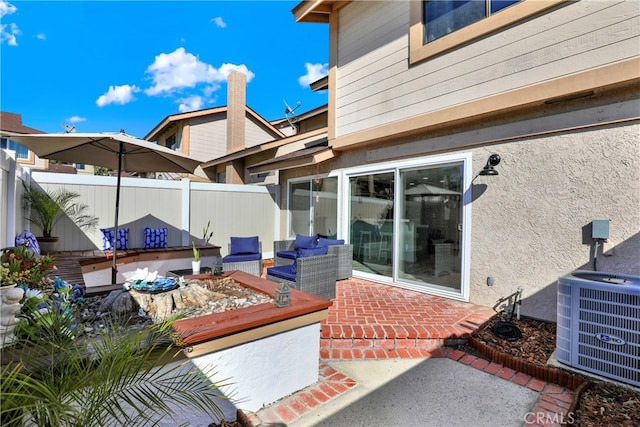 view of patio / terrace with central AC, fence, and an outdoor living space