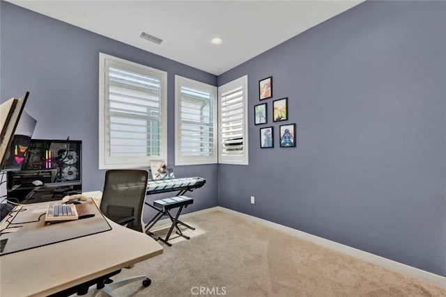 office with carpet floors, visible vents, and baseboards