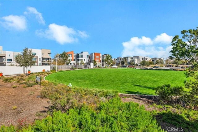 view of yard featuring a residential view and fence