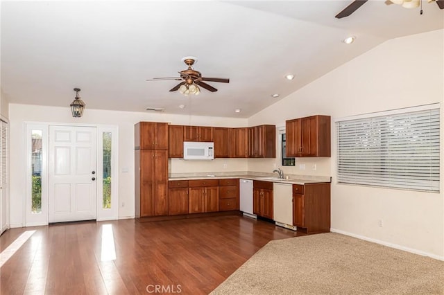 kitchen with white appliances, light countertops, a sink, and ceiling fan