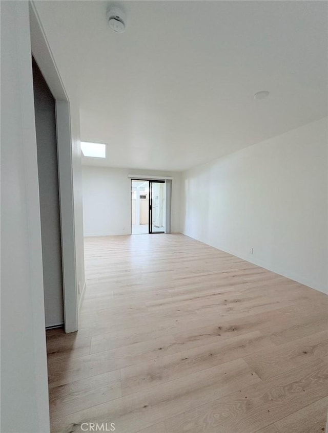 unfurnished room with wood finished floors