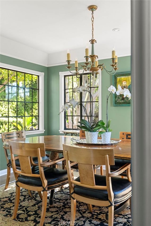 dining space featuring a notable chandelier