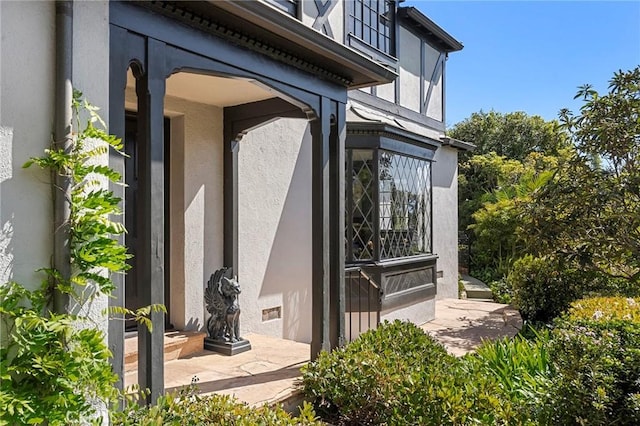 view of property exterior with stucco siding