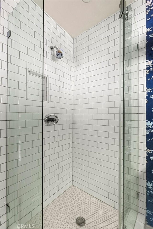 full bathroom with a shower stall