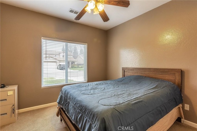 bedroom featuring carpet, visible vents, and baseboards