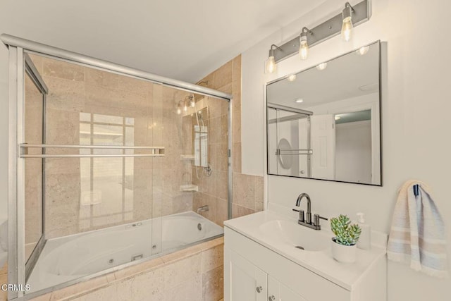 full bathroom featuring a combined bath / shower with jetted tub and vanity