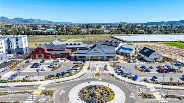 birds eye view of property with a mountain view