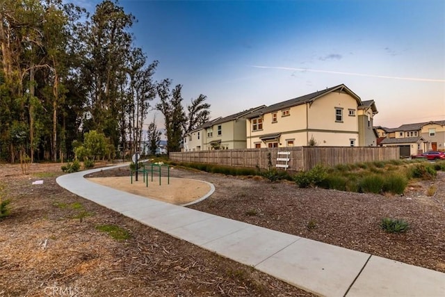 surrounding community featuring a residential view and fence