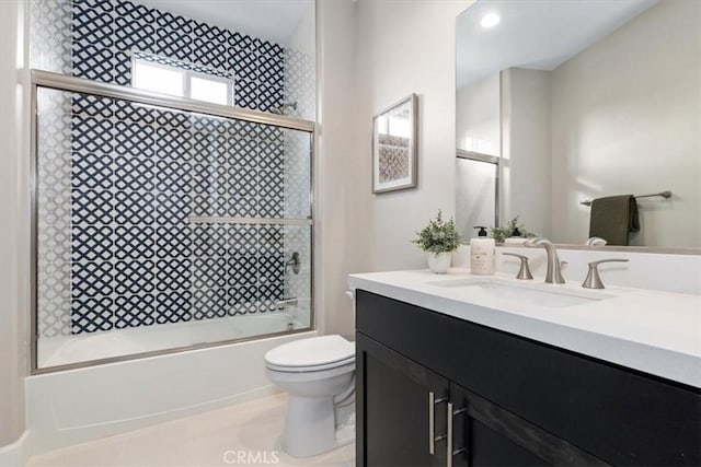 full bathroom with combined bath / shower with glass door, vanity, and toilet