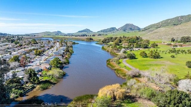 bird's eye view with a water and mountain view