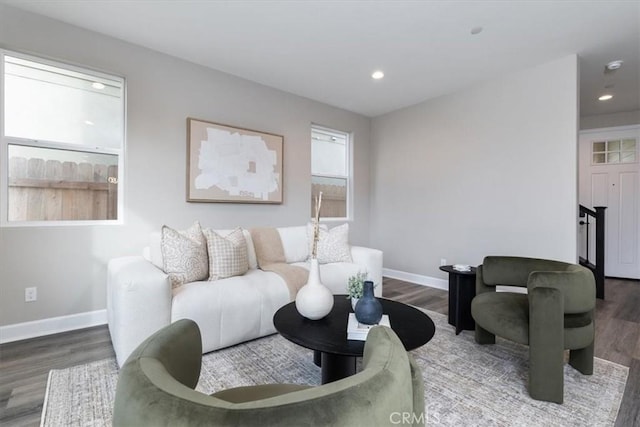 living room featuring recessed lighting, wood finished floors, and baseboards